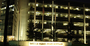 Exterior night view of a commercial building with custom lighting