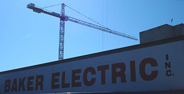 Baker Electric signage on building with crane in background
